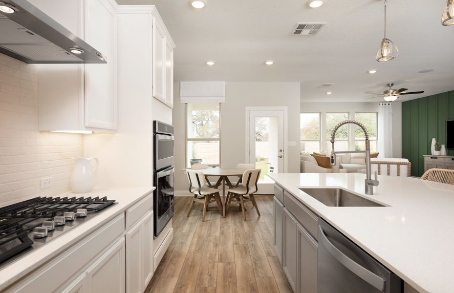 Large kitchen island overlooks main living spaces