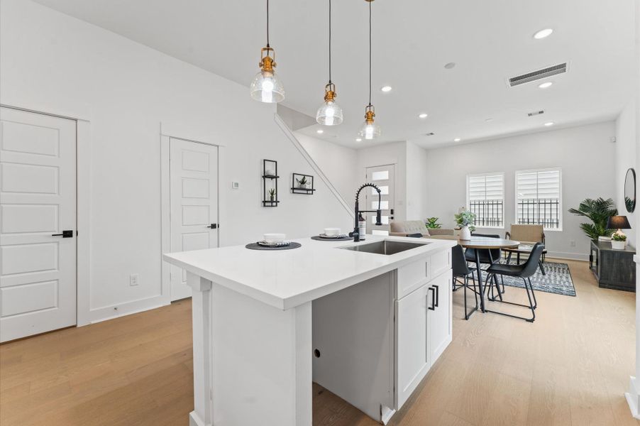 At the heart of this open-concept kitchen lies a stunning oversized island, offering generous prep space, sleek quartz countertops, and seating area. Whether you're hosting a dinner party or enjoying a casual breakfast, this island is the perfect gathering spot. Pendant lighting adds a touch of elegance, while built-in storage and a deep sink make it as functional as it is beautiful. At the heart of this open-concept kitchen lies a stunning oversized island, offering generous prep space, sleek quartz countertops, and seating area. Whether you're hosting a dinner party or enjoying a casual breakfast, this island is the perfect gathering spot. Pendant lighting adds a touch of elegance, while built-in storage and a deep sink make it as functional as it is beautiful.