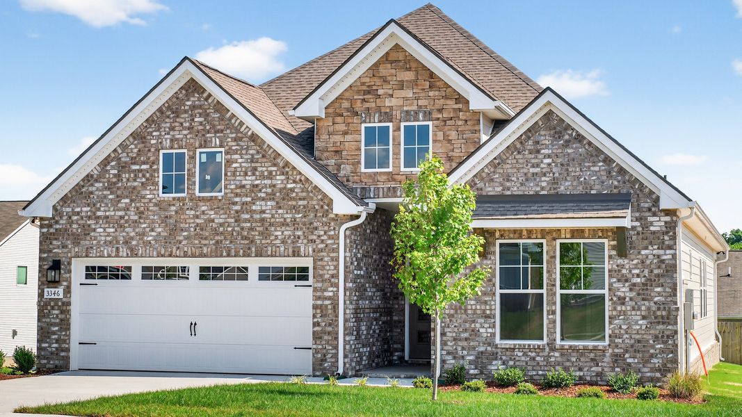 Front exterior of a new home in McClure Farms, Columbia, TN, highlighting curb appeal (Image 25).