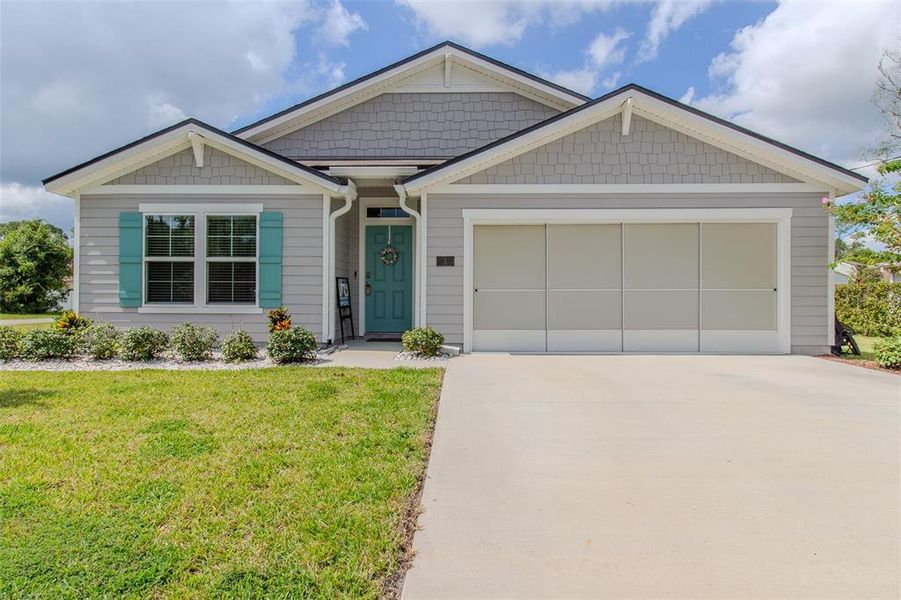 Front exterior of a new home in Palm Coast Homesites, Palm Coast, FL, highlighting curb appeal (Image 19).