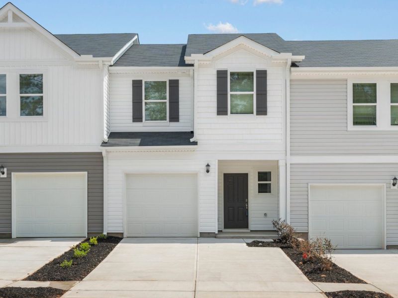 Front exterior of a new home in Avalon Townes, Lyman, SC, highlighting curb appeal (Image 2).