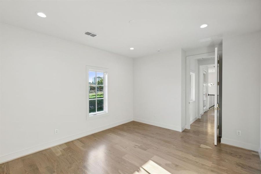 Empty room with light wood-type flooring