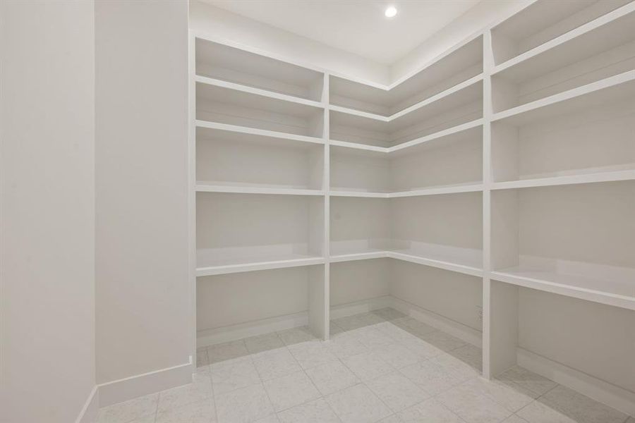 Large storage closet upstairs with extensive shelving. Large storage closet upstairs with extensive shelving.
