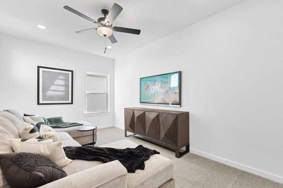 Carpeted living area featuring recessed lighting and ceiling fan Carpeted living area featuring recessed lighting and ceiling fan