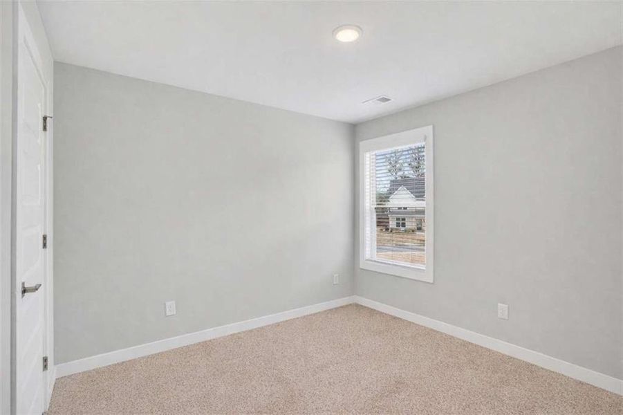 Spacious, unfurnished interior of a new home in The Fairways at Mirror Lake, Villa Rica (Image 24).
