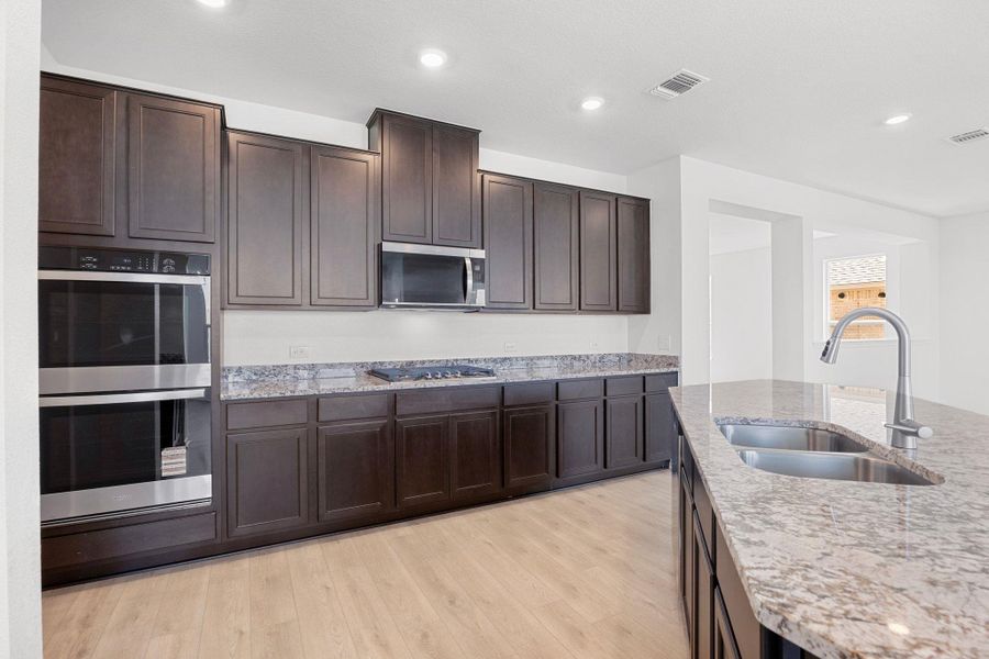 Furnished interior view inside a new home in Salerno - Classic Collection, Round Rock (Image 8). Furnished interior view inside a new home in Salerno - Classic Collection, Round Rock (Image 8).