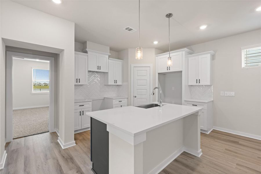 Cozy kitchen, with a stylish two toned island.