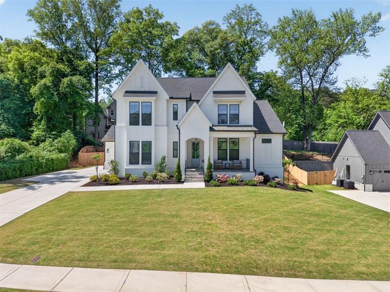 Front exterior of a new home in Town Farms, Peachtree Corners, GA, highlighting curb appeal (Image 31).