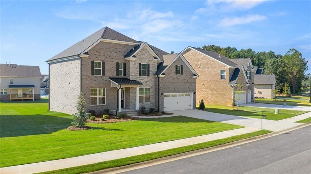 Front exterior of a new home in Westland, Bogart, GA, highlighting curb appeal (Image 25). Front exterior of a new home in Westland, Bogart, GA, highlighting curb appeal (Image 25).
