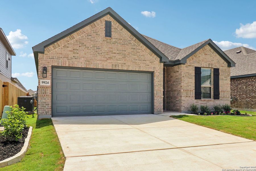 Front exterior of a home in the Kallison Ranch community, located in San Antonio, TX (Image 18).
