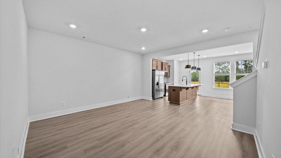 Hardwood flooring family room in two story townhome at Ransdell Pointe by DRB Homes in Spartanburg, SC