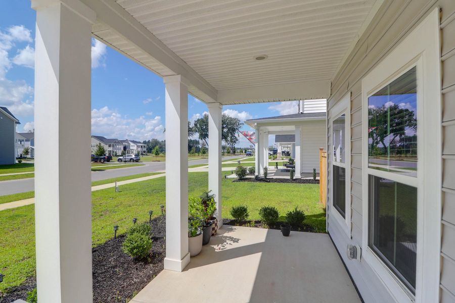 Exterior details and patio area of a home in Sweetgrass at Summers Corner: Arbor Collection, Summerville (Image 31).