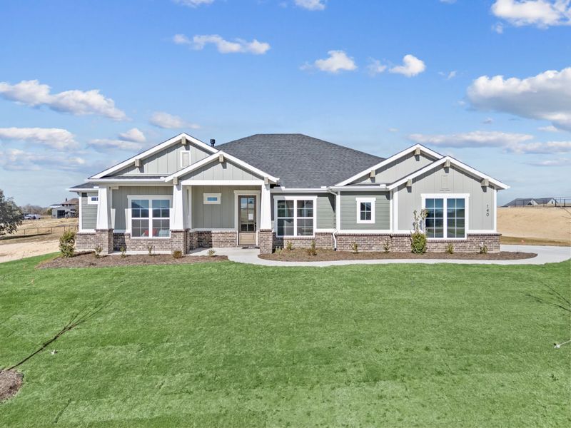 Front exterior of a new home in Rocky Top Ranch, Reno, TX, highlighting curb appeal (Image 2). Front exterior of a new home in Rocky Top Ranch, Reno, TX, highlighting curb appeal (Image 2).