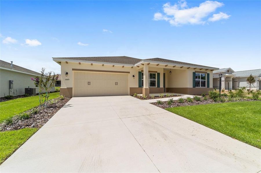 Front exterior of a new home in On Top of the World Communities, Ocala, FL, highlighting curb appeal (Image 16).