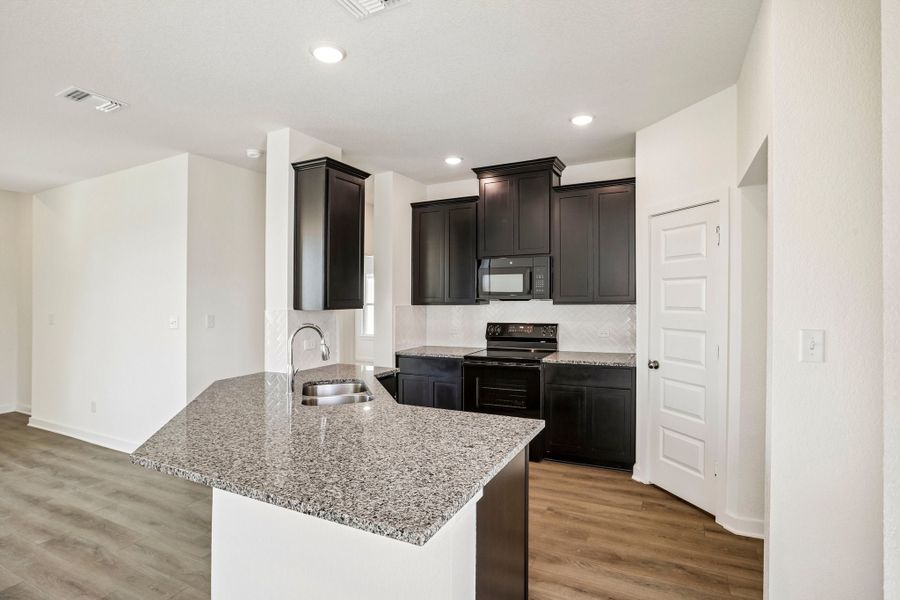 Furnished interior view inside a new home in Rancho San Gabriel, Georgetown (Image 11).