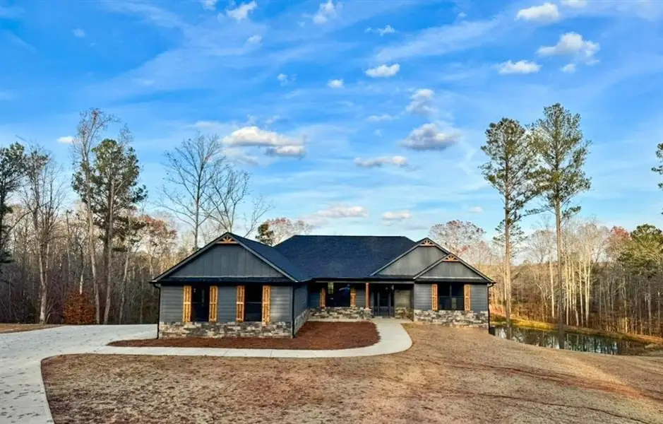 Front exterior of a new home in , Bremen, GA, highlighting curb appeal (Image 23). Front exterior of a new home in , Bremen, GA, highlighting curb appeal (Image 23).