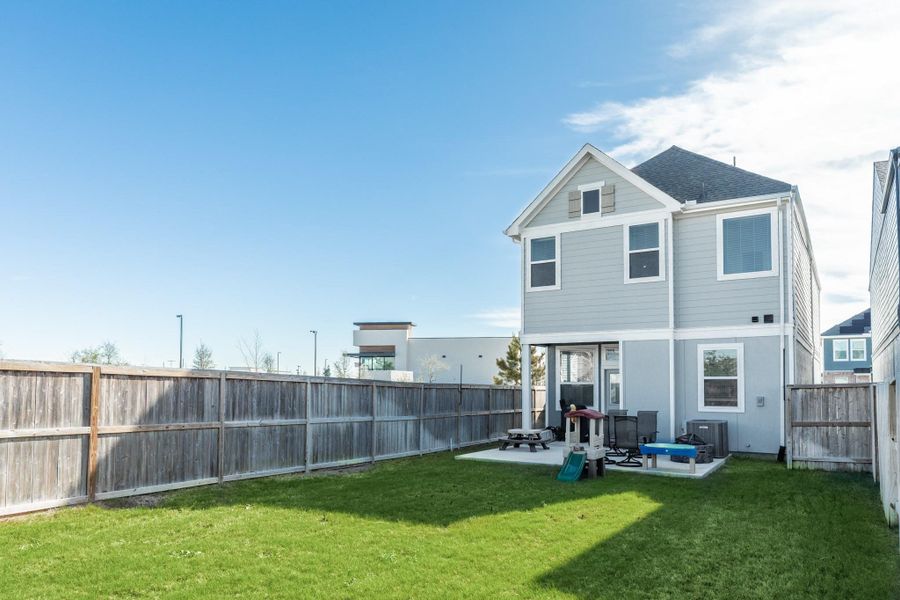 Fenced backyard on a corner lot, providing ample opportunity for personalization.
