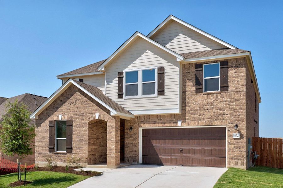 Front exterior of a new home in Salerno - Classic Collection, Round Rock, TX, highlighting curb appeal (Image 21). Front exterior of a new home in Salerno - Classic Collection, Round Rock, TX, highlighting curb appeal (Image 21).