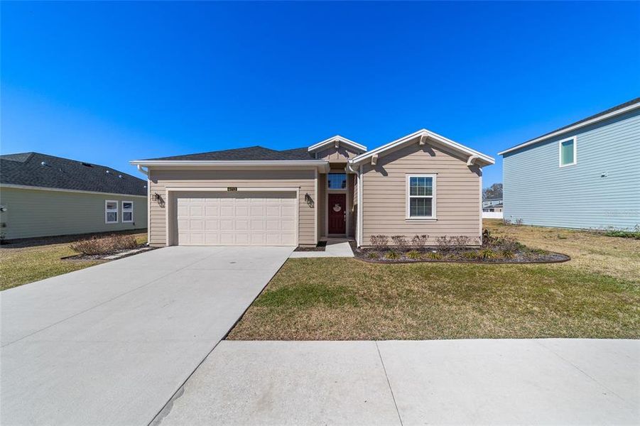 Front exterior of a new home in Millwood, Ocala, FL, highlighting curb appeal (Image 26).