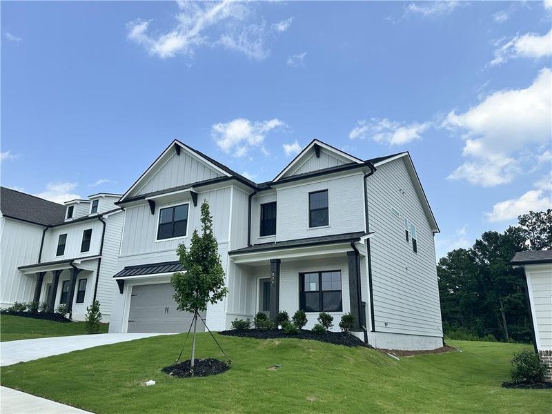 Front exterior of a new home in Summerlin, Winder, GA, highlighting curb appeal (Image 20).