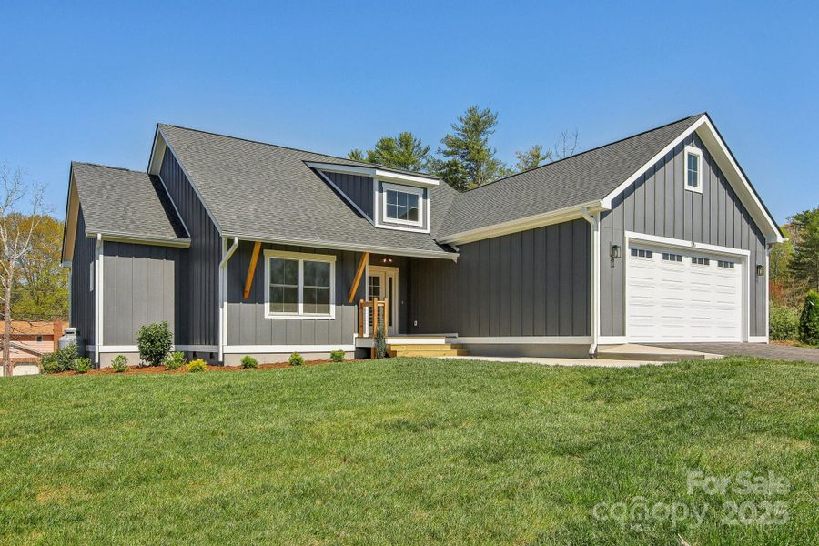Front exterior of a new home in , Hendersonville, NC, highlighting curb appeal (Image 17).