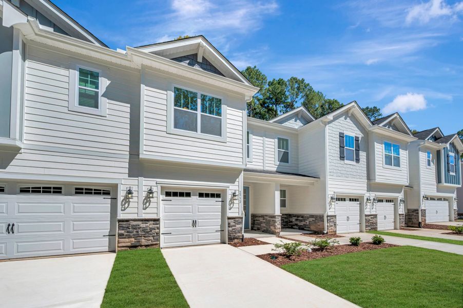 Front exterior of a new home in Ashmore Townes, Garner, NC, highlighting curb appeal (Image 26).