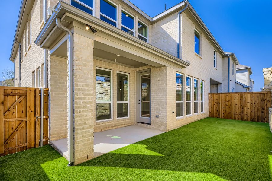 Exterior details and patio area of a home in Castle Hills Northpointe - Townhomes, Lewisville (Image 4).
