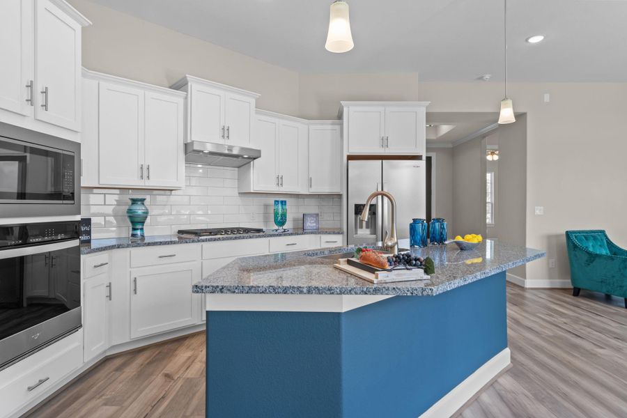 Experience culinary excellence in the kitchen at Winfrey Estates, where state-of-the-art appliances meet sophisticated design. This gourmet space boasts expansive countertops, stylish cabinetry, and top-of-the-line fixtures, creating an ideal environment for both casual meals and lavish entertaining. Image depicts home as-is.