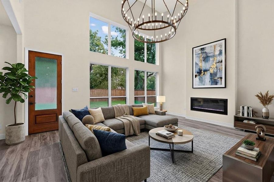 Vaulted ceilings with an expansive chandelier, floor-to-ceiling windows, and wood-finish flooring
