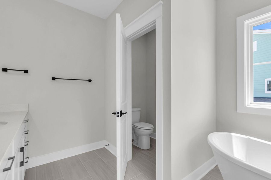 Furnished interior view inside a new home in Tidewater at Lakes of Cane Bay, Summerville (Image 4).