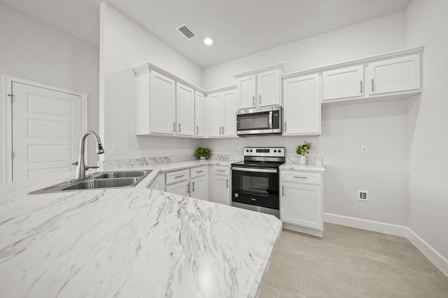 Representative furnished interior of a home built from the 1635 by Adams Homes in Winding Oaks, Weeki Wachee (Image 10).