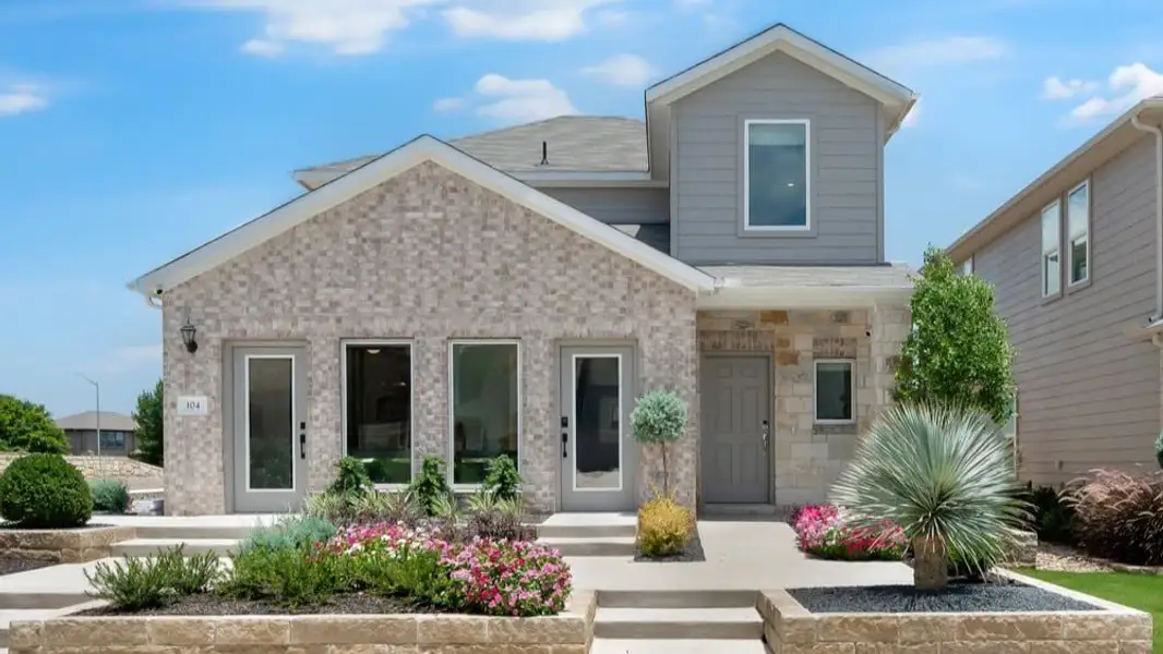 Representative exterior photo of a completed home built from the Hawk by Taylor Morrison in Longview 40s, Del Valle, TX (Image 1).
