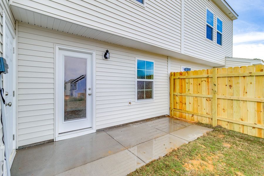 Exterior details and patio area of a home in Padgett Commons, Hopkins (Image 3).