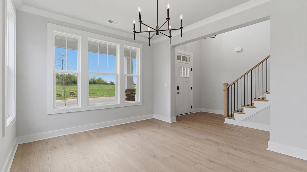 Notable dining room with high standards and elegant millwork in this accomplished home at Foxbank