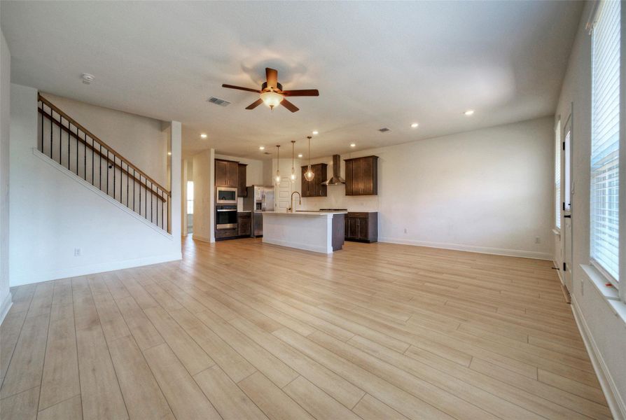 An open floor plan seamlessly connects the kitchen with the main living area. An open floor plan seamlessly connects the kitchen with the main living area.