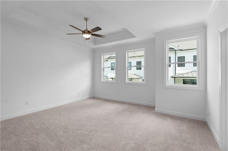 primary bedroom with ceiling fan, and massive must see walk in closet - Pictures represent a previously built home