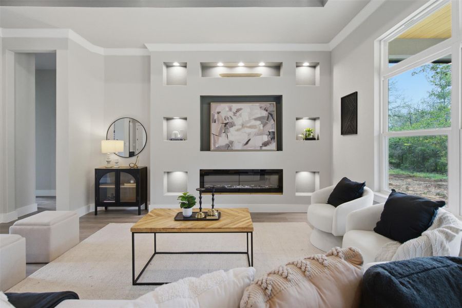 A refined living space features a captivating fireplace wall with integrated display niches and expansive windows. A refined living space features a captivating fireplace wall with integrated display niches and expansive windows.