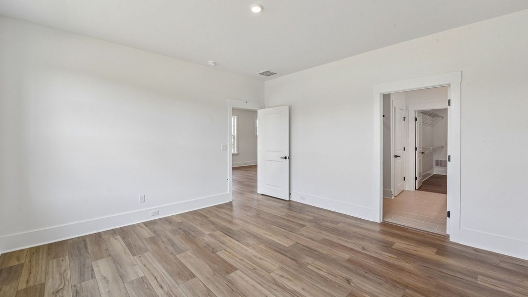 The Awaken Plan in Brook Run, Fort Mill SC - Primary Bedroom connected to Primary bath, walk-in closet and Laundry