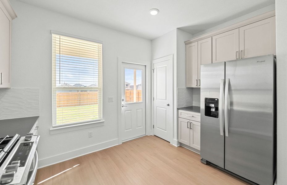 Furnished interior view inside a new home in Crosswinds, Kyle (Image 9).