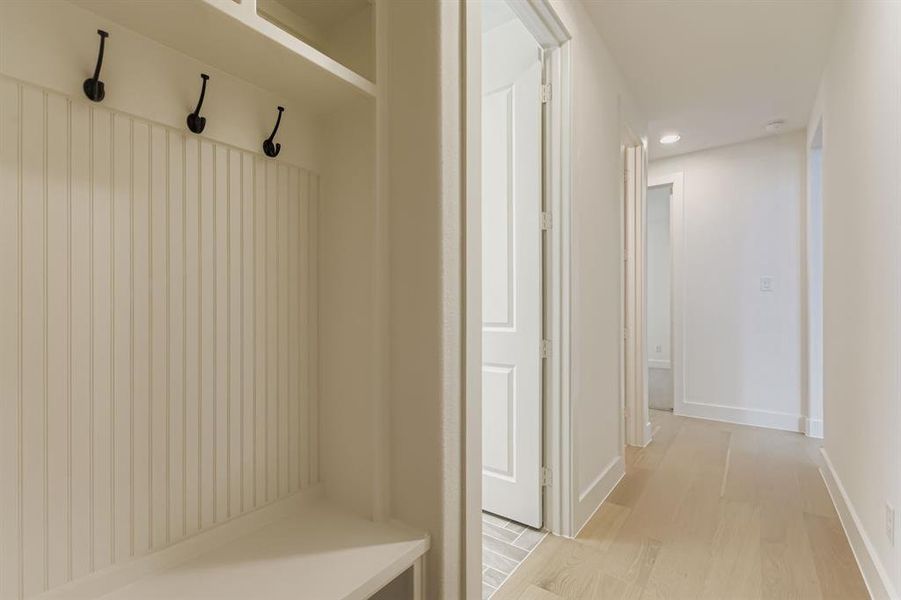 Mudroom featuring light wood finished floors and recessed lighting Mudroom featuring light wood finished floors and recessed lighting