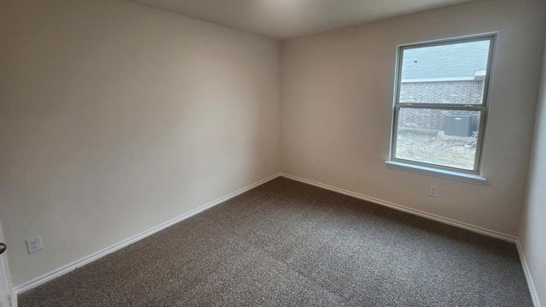 Neutral-toned wall paint and matching carpet flooring