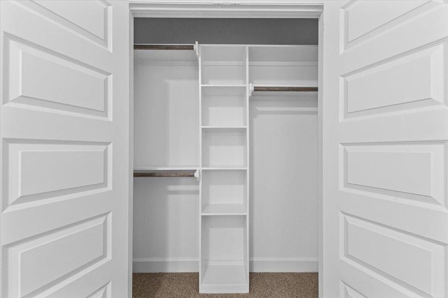 Primary walk-in closet with built-in shelves-great for organizing