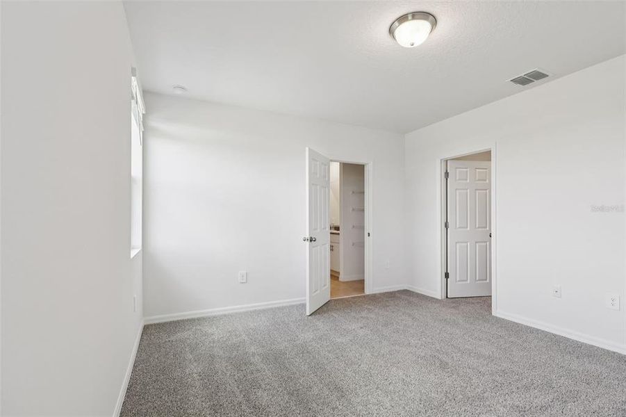 Spacious, unfurnished interior of a new home in Lake Deer Estates - Signature Series, Poinciana (Image 29).