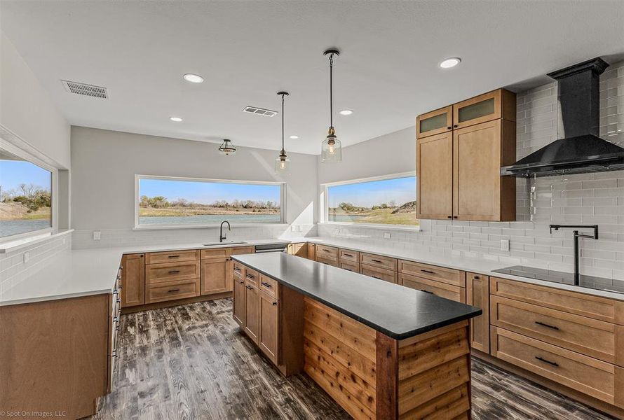 Dream kitchen with SO much custom cabinetry, pot filler with electric range.  However, this kitchen is ALL about the views!