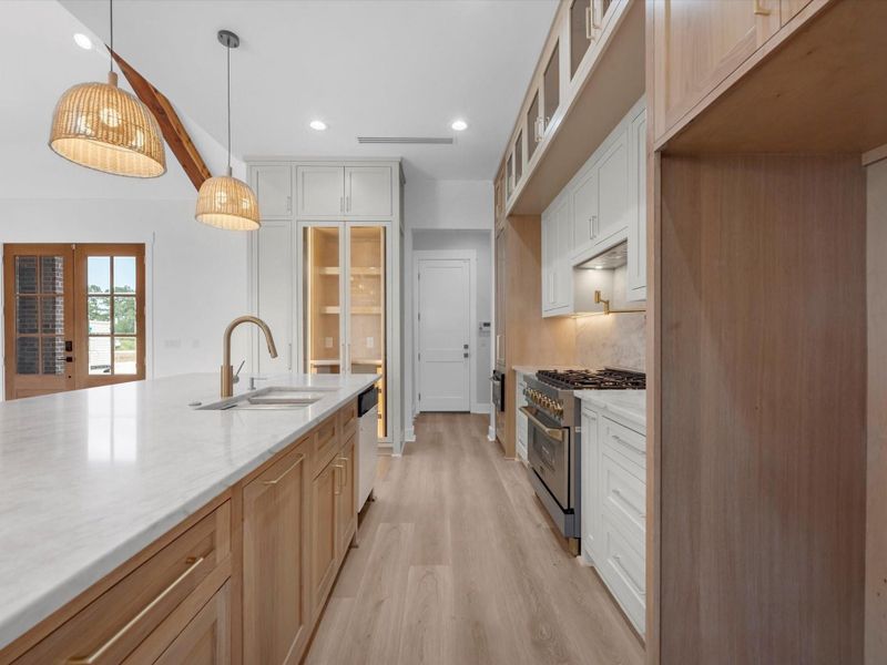 You'll find custom cabinetry throughout, but the details here are; white oak cabinetry, glass face cabinets, luxury appliances, and much much more.