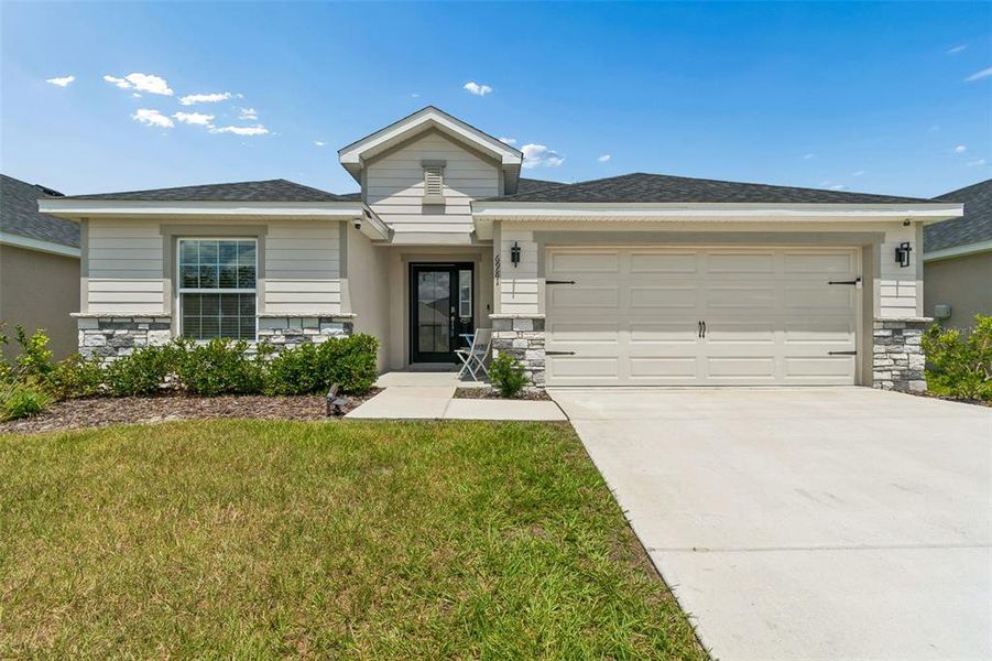 Front exterior of a new home in , Zephyrhills, FL, highlighting curb appeal (Image 28).