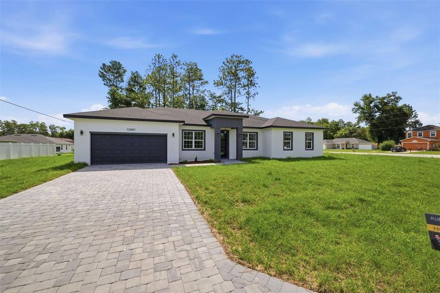 Front exterior of a new home in , Ocala, FL, highlighting curb appeal (Image 21). Front exterior of a new home in , Ocala, FL, highlighting curb appeal (Image 21).