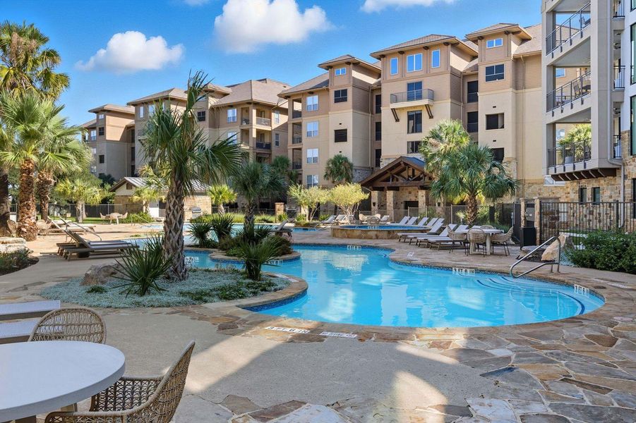 Community pool with a patio area
