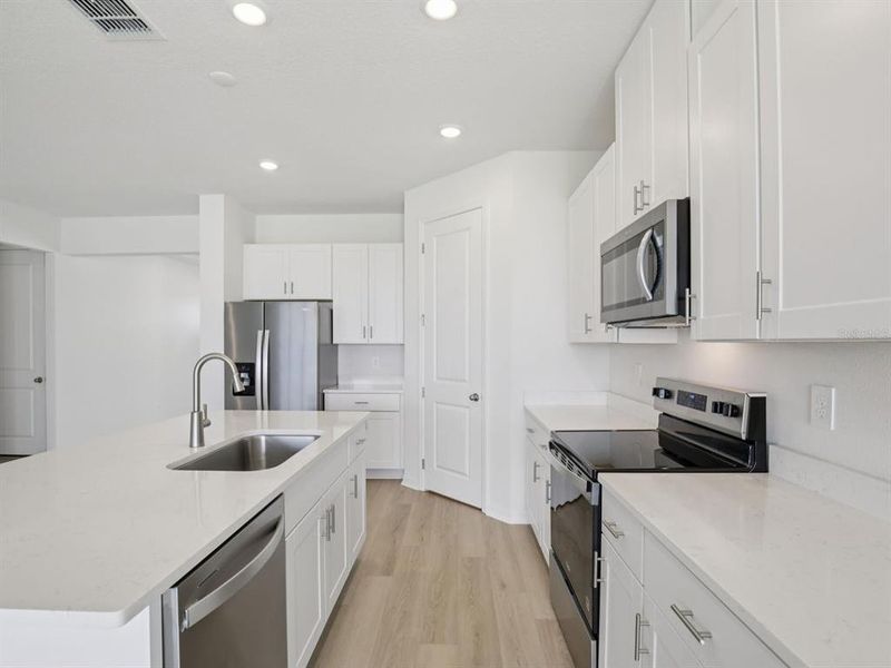 Furnished interior view inside a new home in Coasterra - Reserve Series, Palmetto (Image 13).
