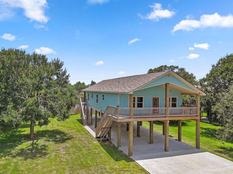 Front exterior of a new home in , Sargent, TX, highlighting curb appeal (Image 22). Front exterior of a new home in , Sargent, TX, highlighting curb appeal (Image 22).